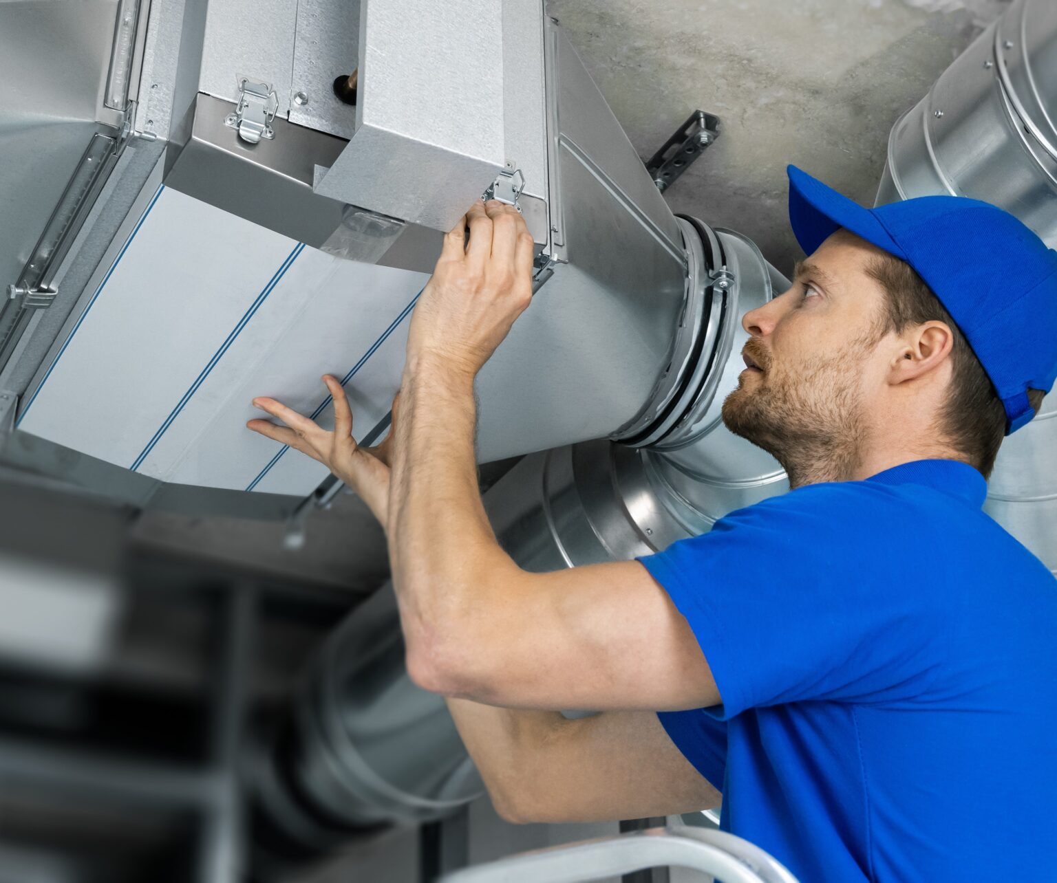 ventilation system installation and repair service. hvac technician at work. banner copy space
