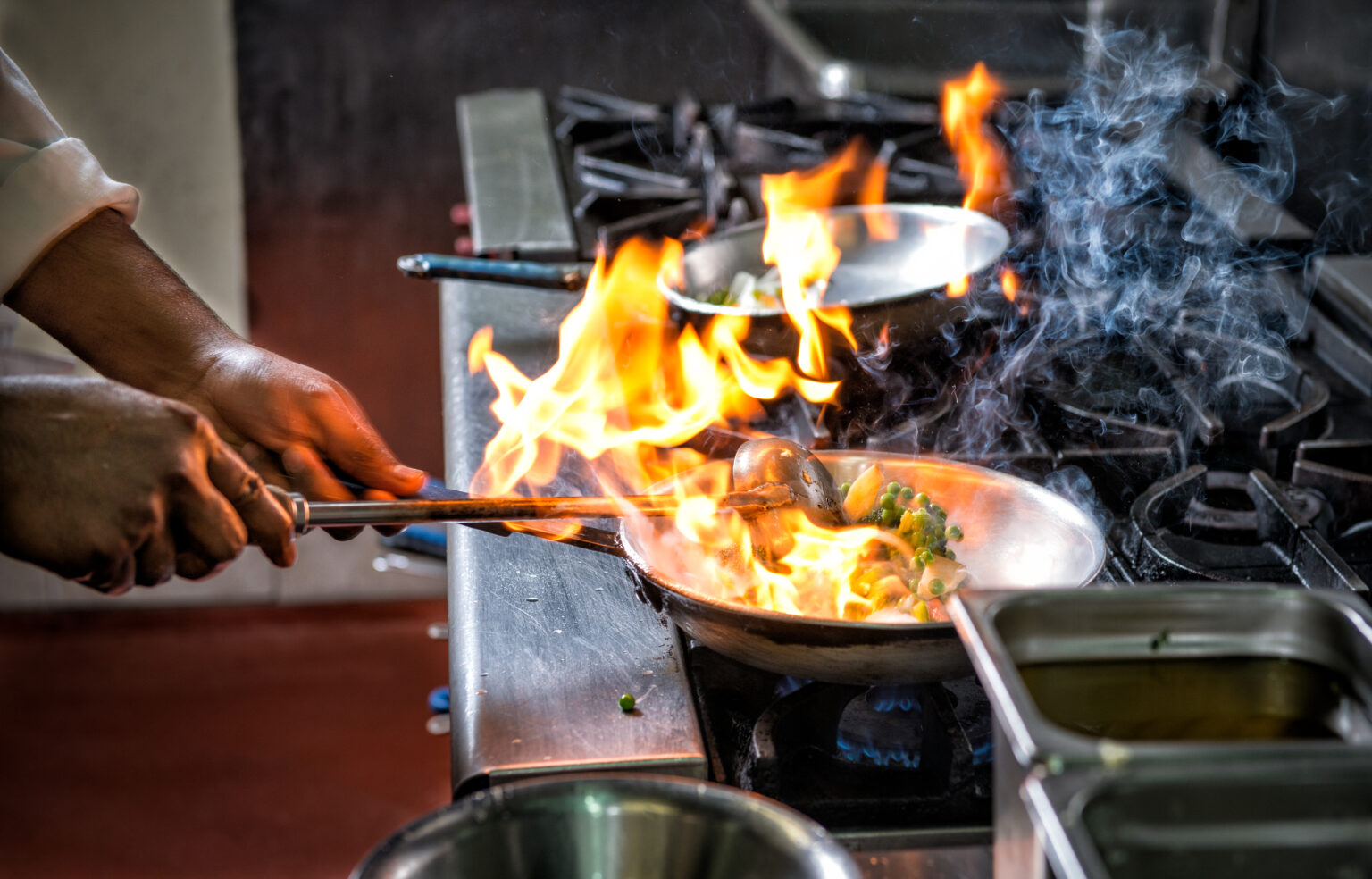 Preparing Indian food by Flame in frying pan